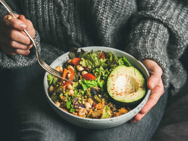 Person holding healthy salad